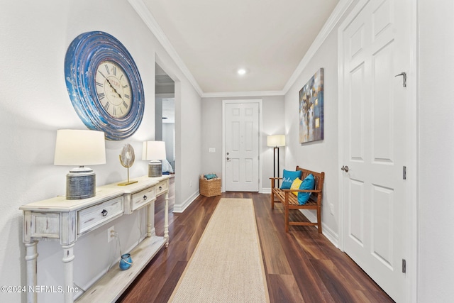 entryway with ornamental molding and dark hardwood / wood-style flooring