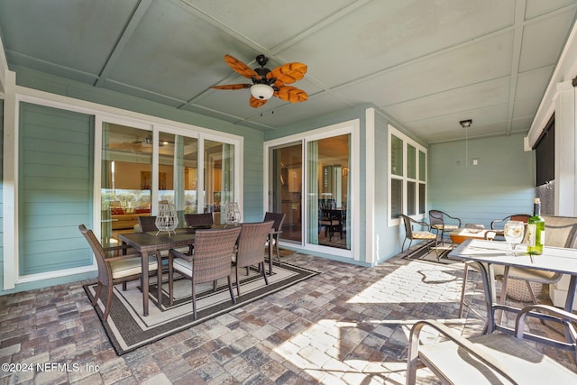 view of patio featuring ceiling fan and outdoor dining space