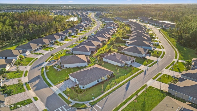 aerial view with a residential view and a view of trees