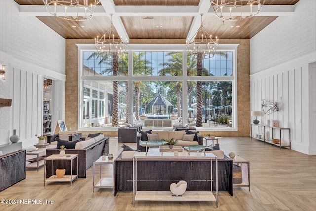 living room featuring a high ceiling, wood ceiling, and light parquet flooring