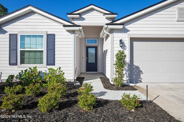 entrance to property with a garage