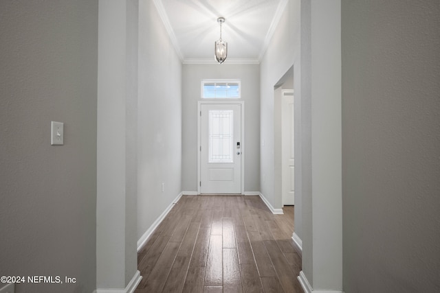 entryway with crown molding and hardwood / wood-style flooring