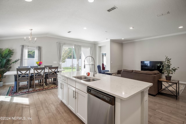 kitchen featuring sink, dishwasher, white cabinetry, light hardwood / wood-style floors, and a kitchen island with sink