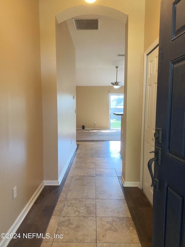 corridor featuring tile patterned flooring