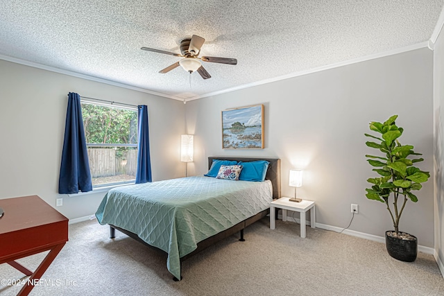 bedroom with ornamental molding, carpet floors, a textured ceiling, and ceiling fan