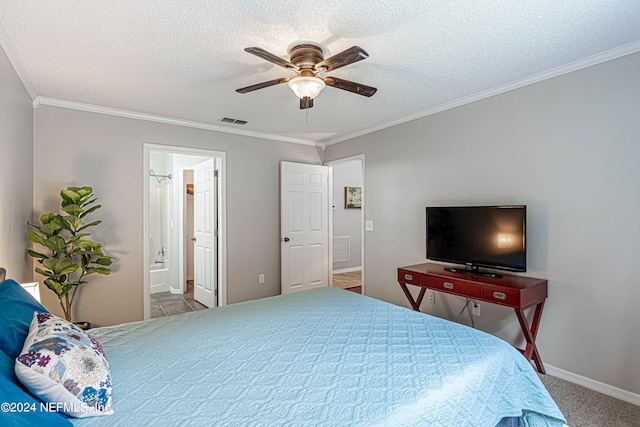 bedroom featuring light carpet, ceiling fan, a textured ceiling, connected bathroom, and crown molding