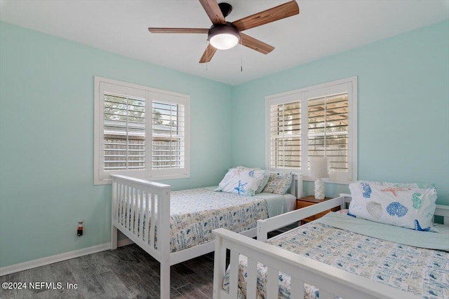 bedroom with hardwood / wood-style floors and ceiling fan