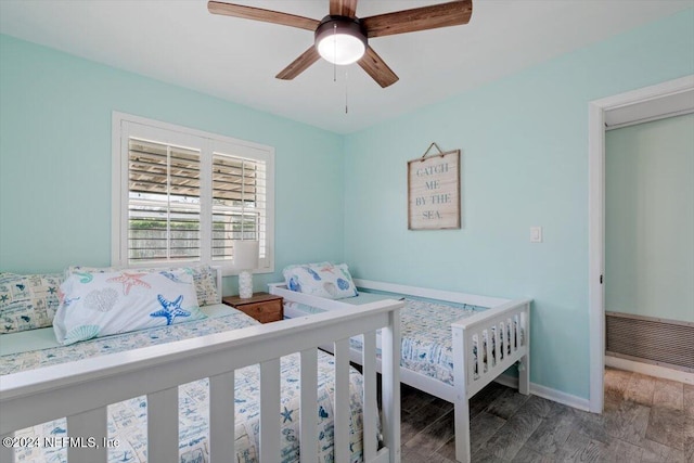 bedroom featuring hardwood / wood-style floors and ceiling fan