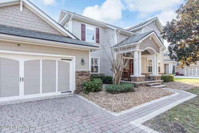 craftsman house with a garage