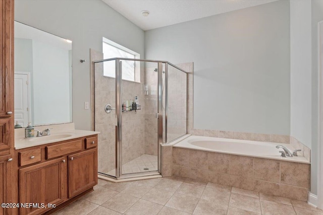 bathroom with vanity, plus walk in shower, and tile patterned floors