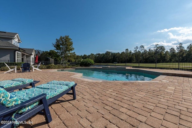 view of swimming pool featuring a patio area