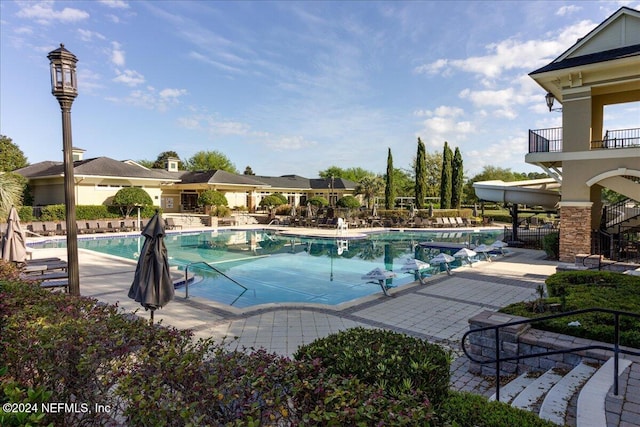 view of swimming pool with a patio area