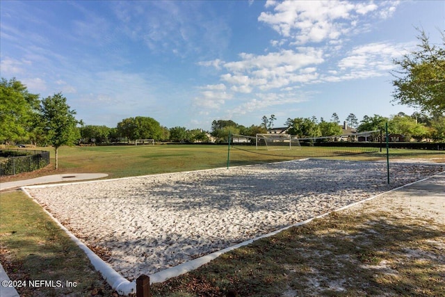 view of home's community with a yard and volleyball court