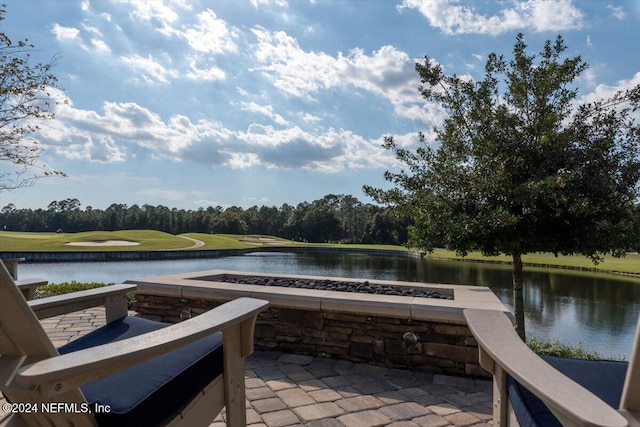 view of swimming pool with a water view