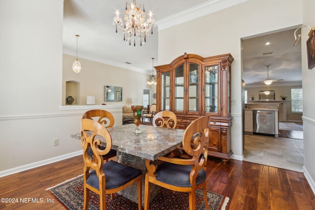 dining area featuring ceiling fan, ornamental molding, and dark hardwood / wood-style floors