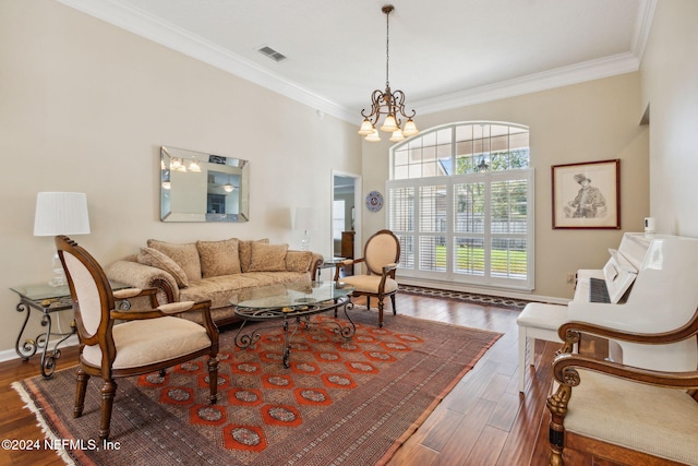 living room featuring crown molding, a notable chandelier, and dark hardwood / wood-style flooring