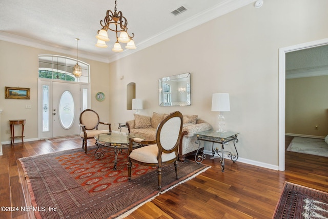 interior space with ornamental molding, dark hardwood / wood-style floors, and a chandelier