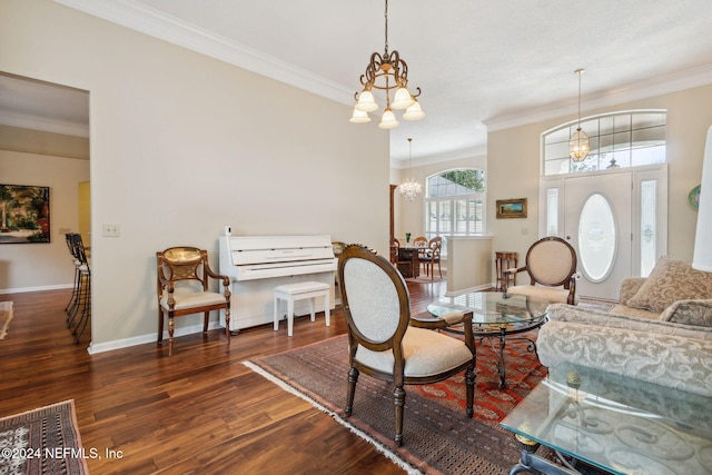 interior space featuring ornamental molding, an inviting chandelier, and dark hardwood / wood-style floors