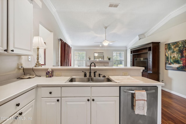 kitchen featuring dishwasher, sink, kitchen peninsula, white cabinets, and dark hardwood / wood-style floors