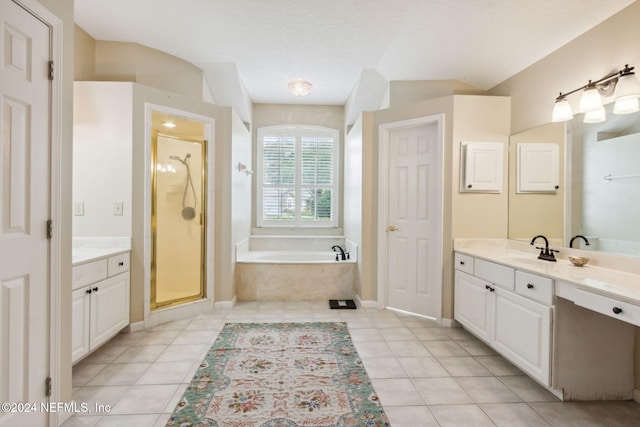 bathroom featuring vanity, tile patterned floors, and separate shower and tub