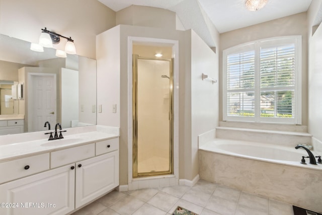 bathroom featuring vanity, tile patterned floors, and shower with separate bathtub