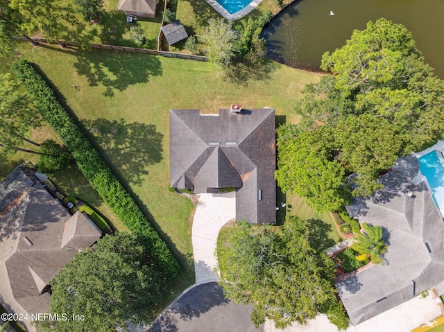 birds eye view of property with a water view