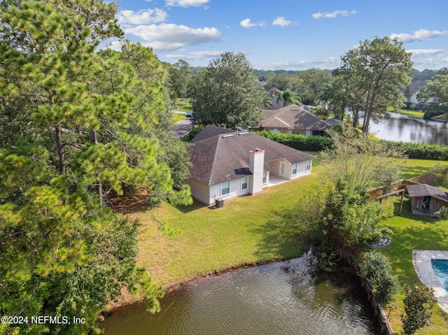 birds eye view of property with a water view