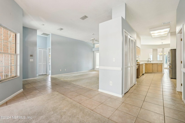 interior space with sink and ceiling fan