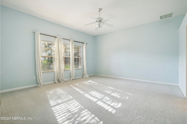 carpeted empty room with ceiling fan