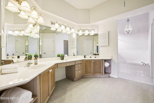 bathroom featuring vanity and tiled bath