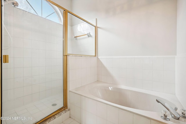 bathroom with independent shower and bath