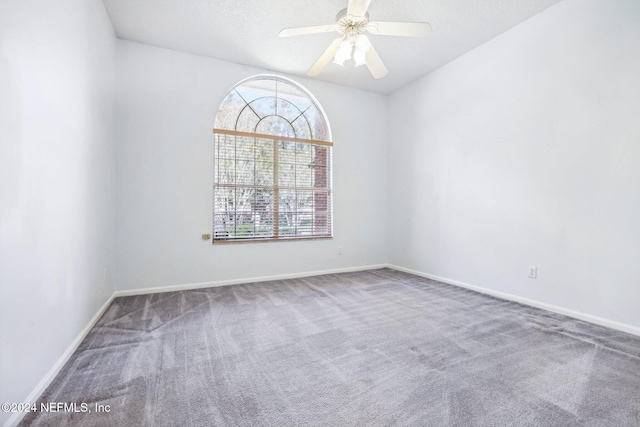 empty room with carpet and ceiling fan