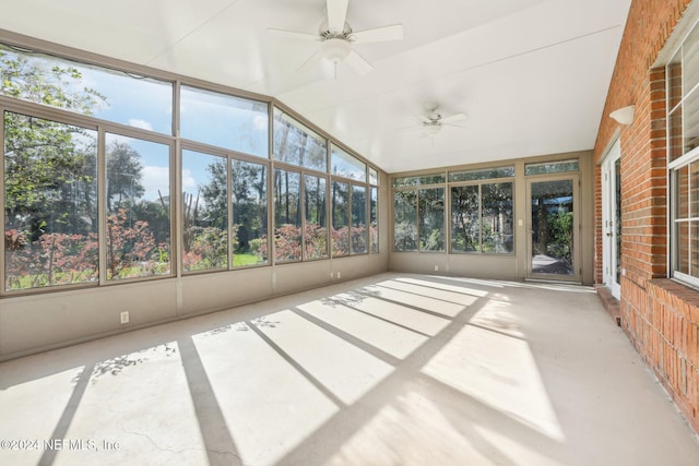 unfurnished sunroom with ceiling fan