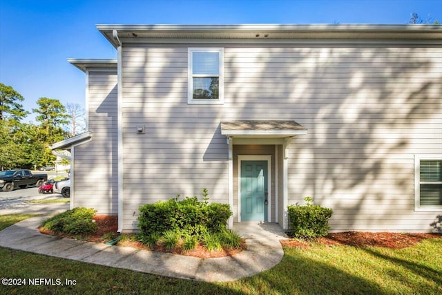 exterior space with a front lawn