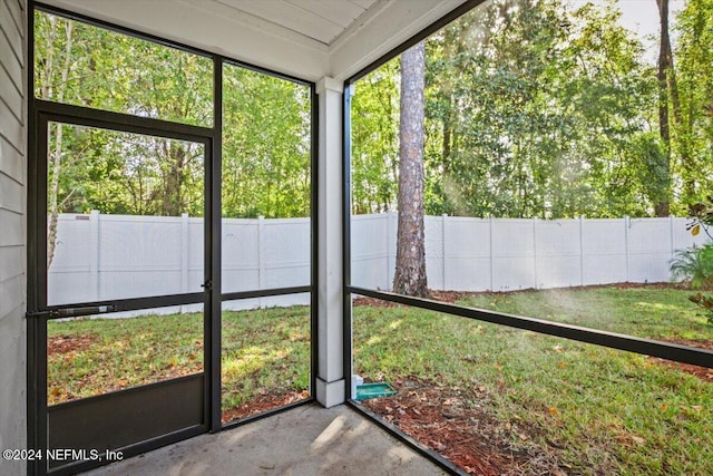 unfurnished sunroom featuring a healthy amount of sunlight