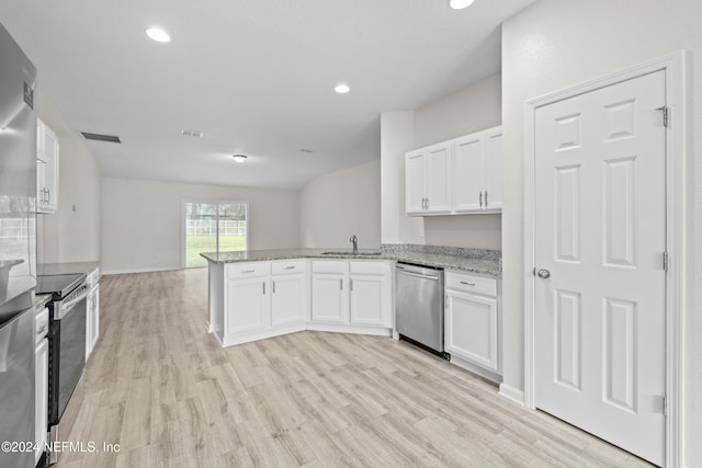 kitchen featuring light hardwood / wood-style floors, appliances with stainless steel finishes, kitchen peninsula, and white cabinets