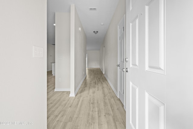 hallway featuring light hardwood / wood-style flooring