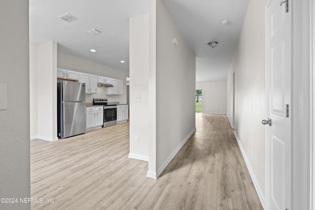 hallway featuring light hardwood / wood-style flooring