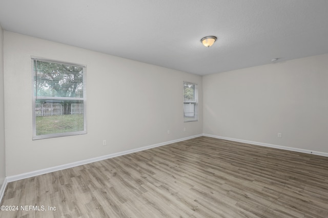 unfurnished room featuring light hardwood / wood-style flooring