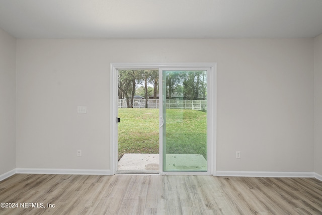 spare room featuring light hardwood / wood-style flooring