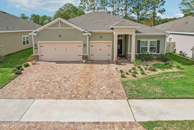 ranch-style home with a front lawn and a garage