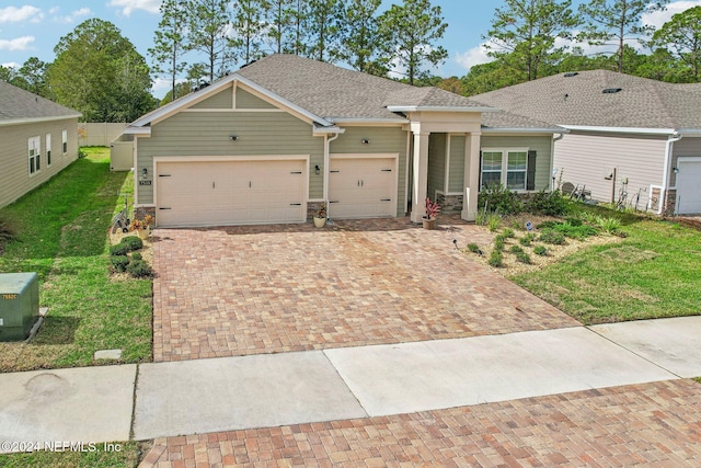 ranch-style house with a front yard and a garage