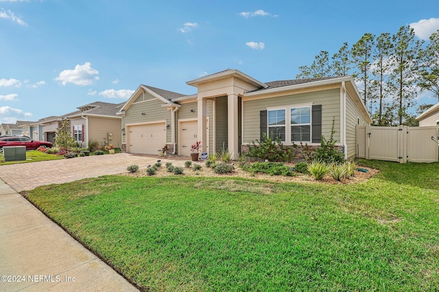 view of front of house with a front lawn and a garage