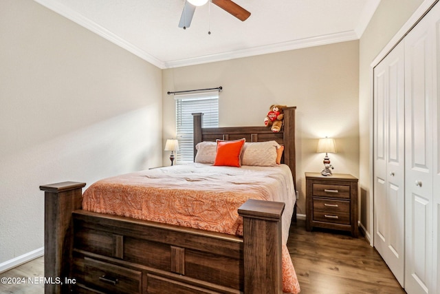 bedroom featuring a closet, wood-type flooring, crown molding, and ceiling fan