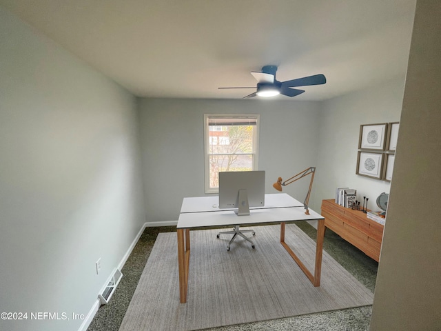 unfurnished office with carpet flooring and ceiling fan