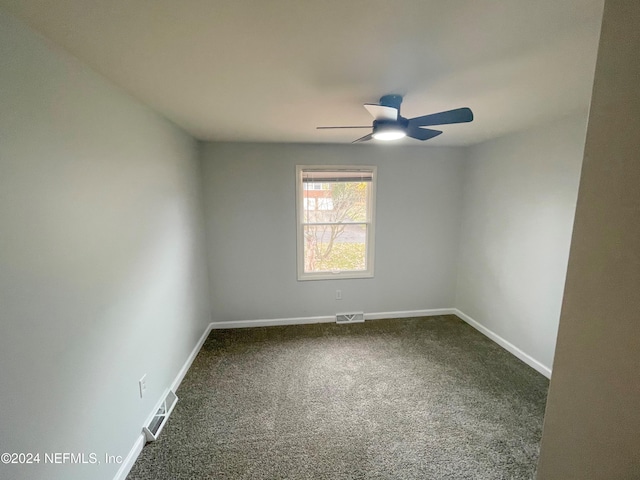 empty room featuring carpet and ceiling fan