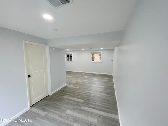 empty room with light hardwood / wood-style flooring