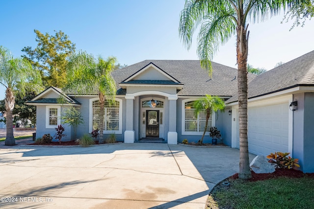 ranch-style home featuring a garage