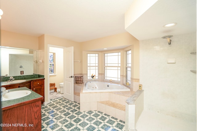 full bathroom featuring vanity, plus walk in shower, toilet, and tile patterned floors