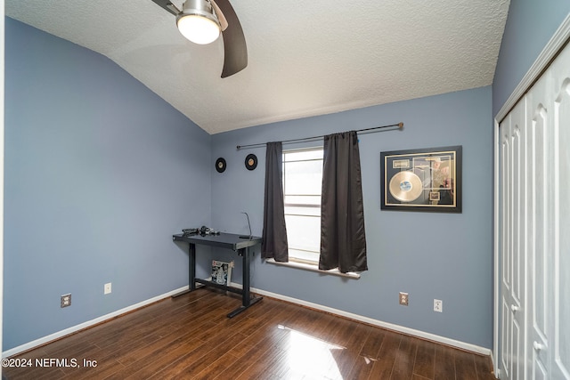 interior space with ceiling fan, hardwood / wood-style flooring, a textured ceiling, and vaulted ceiling